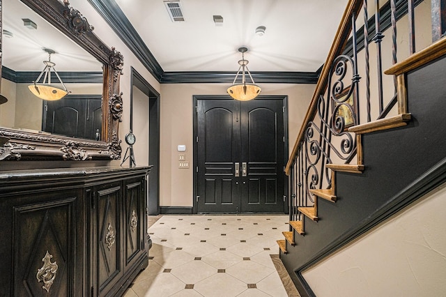 foyer featuring ornamental molding