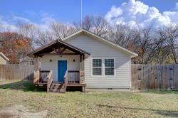 rear view of property with a yard