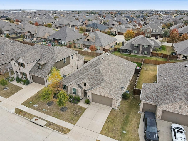 birds eye view of property with a residential view