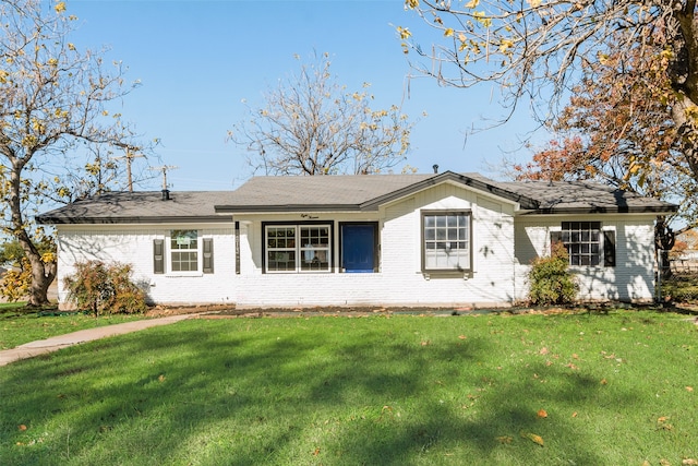 ranch-style house with a front lawn