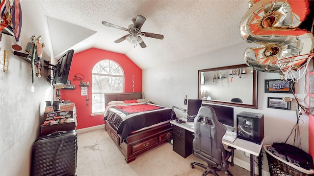 carpeted bedroom with lofted ceiling, ceiling fan, and a textured ceiling