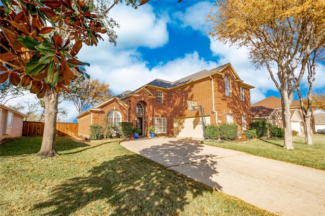 view of front of home with a garage and a front lawn