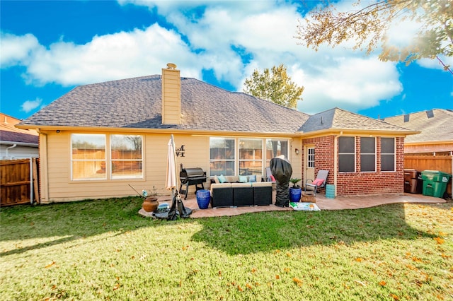 back of house with a lawn, a patio area, and an outdoor living space