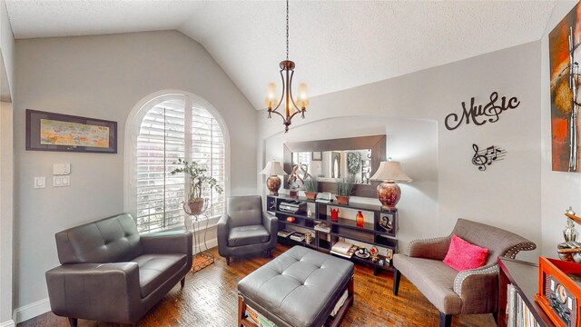 living area with a chandelier, a textured ceiling, vaulted ceiling, and dark wood-type flooring