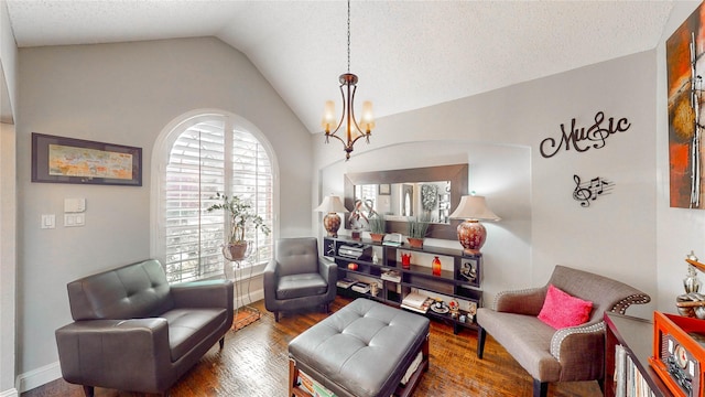 living area featuring lofted ceiling, a textured ceiling, dark hardwood / wood-style floors, and a chandelier