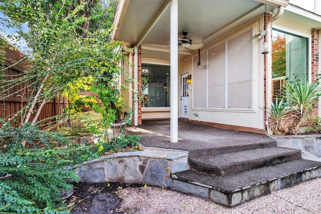 entrance to property with ceiling fan