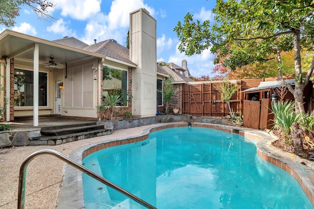 view of pool featuring ceiling fan and a patio