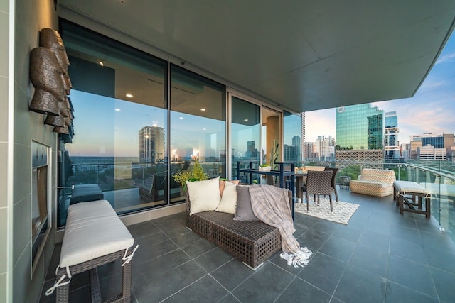 balcony at dusk with outdoor lounge area