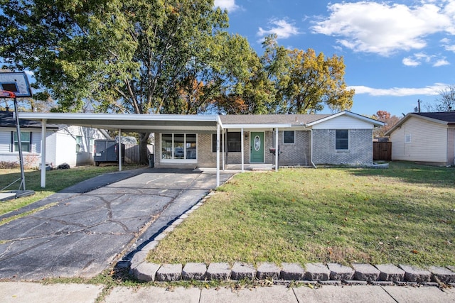 ranch-style home with a front yard and a carport