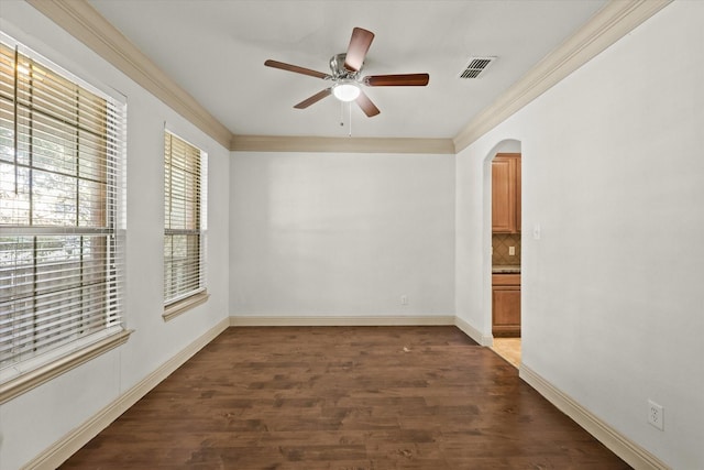 spare room featuring ceiling fan and dark wood-type flooring