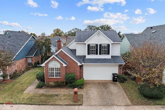 front facade featuring a garage and a front yard