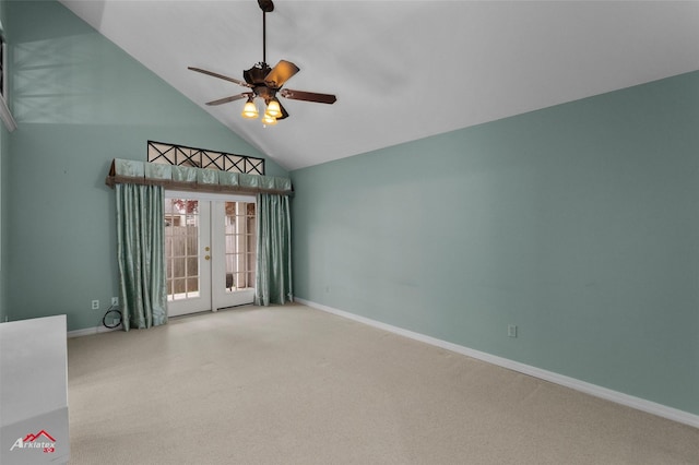 carpeted spare room featuring french doors, ceiling fan, and lofted ceiling