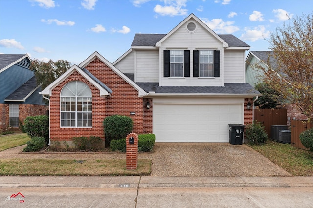 front of property featuring a front yard and a garage