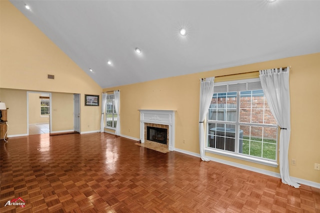 unfurnished living room with a fireplace, high vaulted ceiling, and parquet flooring