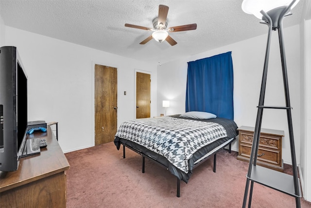 bedroom featuring carpet flooring, ceiling fan, and a textured ceiling