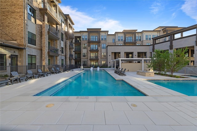 view of swimming pool with a patio