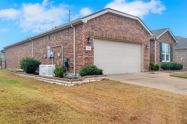 view of property exterior with a yard and a garage