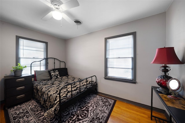 bedroom featuring ceiling fan and wood-type flooring