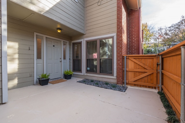 property entrance with a patio area