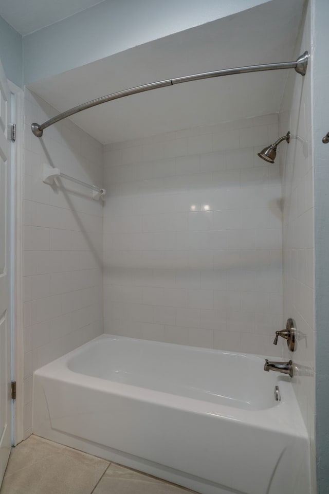 bathroom with tile patterned flooring and tiled shower / bath combo