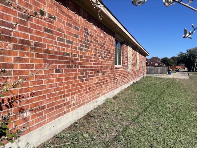 view of property exterior featuring a lawn