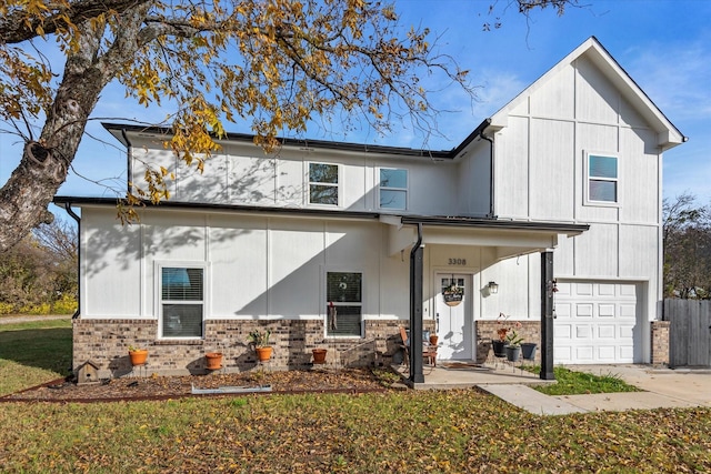 view of front of home featuring a front yard and a garage