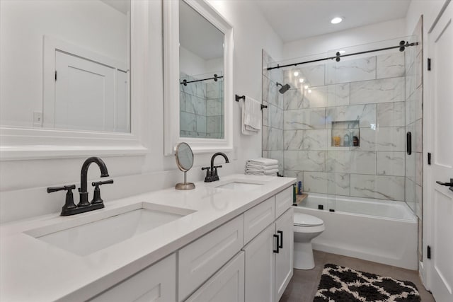 full bathroom featuring enclosed tub / shower combo, vanity, and toilet