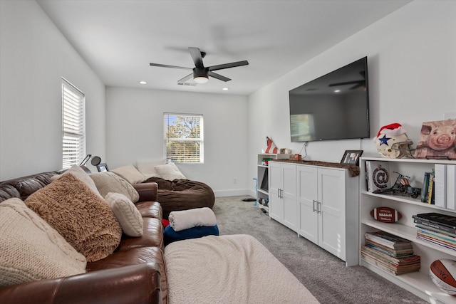 living room featuring ceiling fan and light carpet