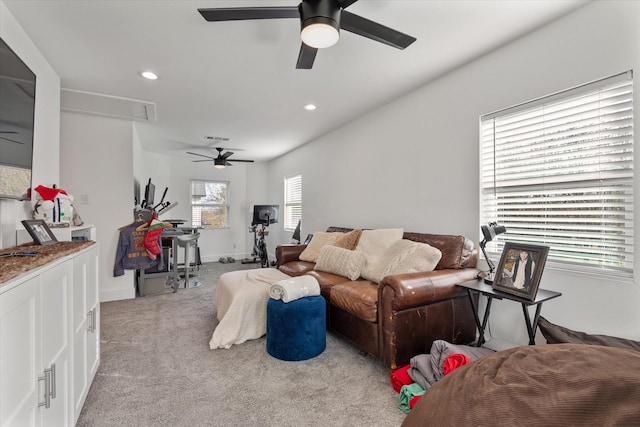 living room with light colored carpet and ceiling fan