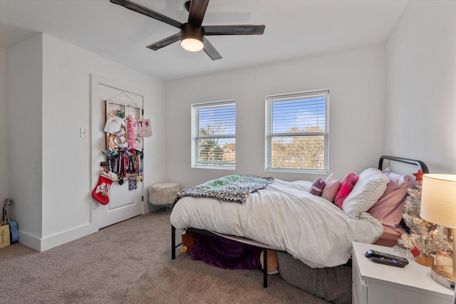 bedroom with ceiling fan and light colored carpet