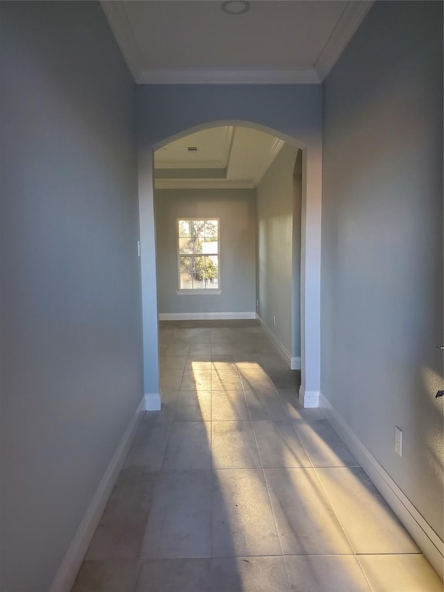 corridor featuring light tile patterned flooring and ornamental molding