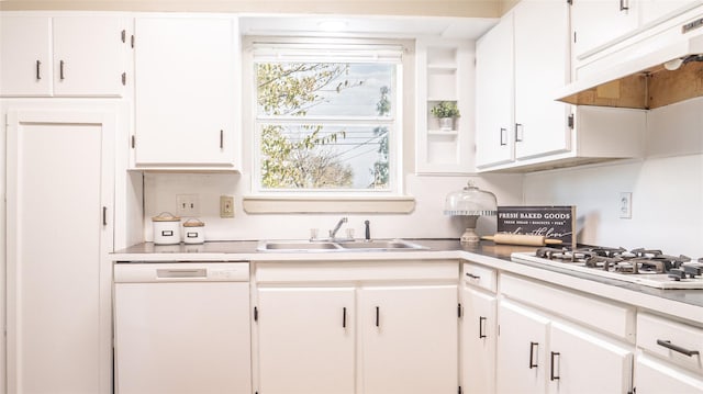 kitchen featuring white appliances, white cabinetry, and sink