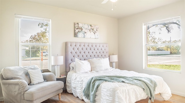 bedroom with ceiling fan and wood-type flooring