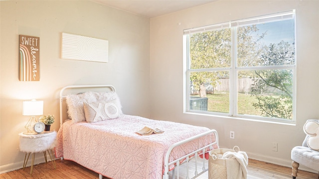 bedroom with wood-type flooring