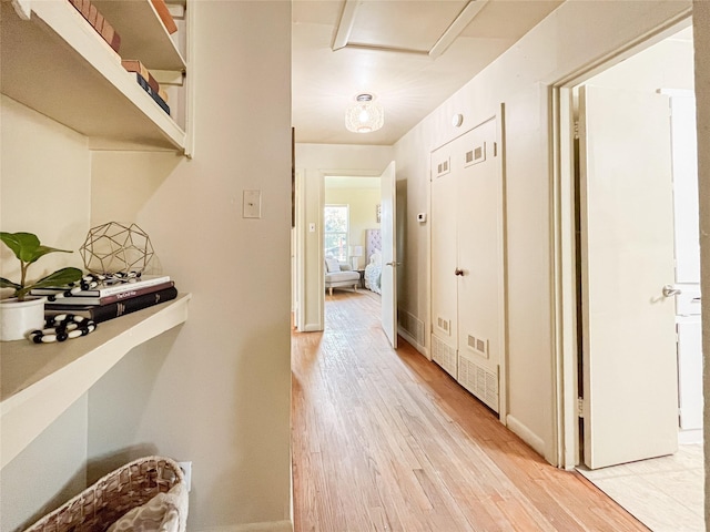 corridor featuring light wood-type flooring