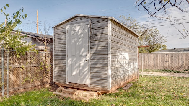 view of outdoor structure with a lawn