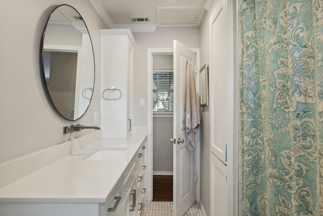 full bath with ornamental molding, visible vents, and vanity