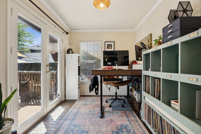 office with wood-type flooring, ornamental molding, and a healthy amount of sunlight