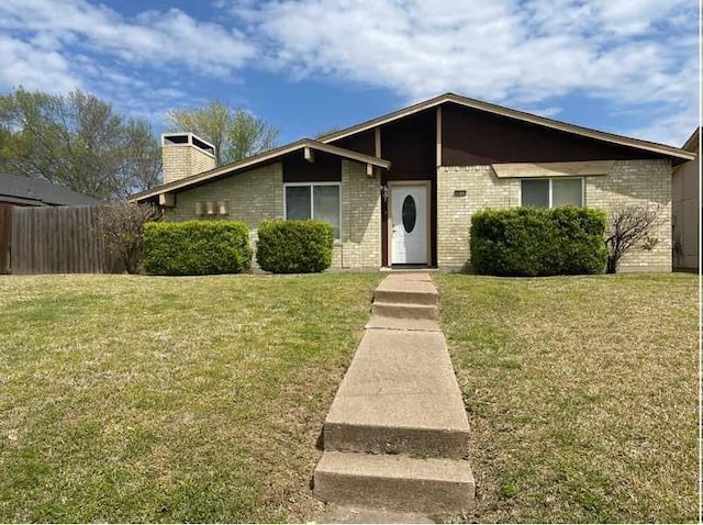 ranch-style home with a front lawn