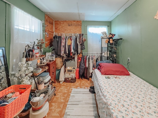 bedroom with light parquet floors