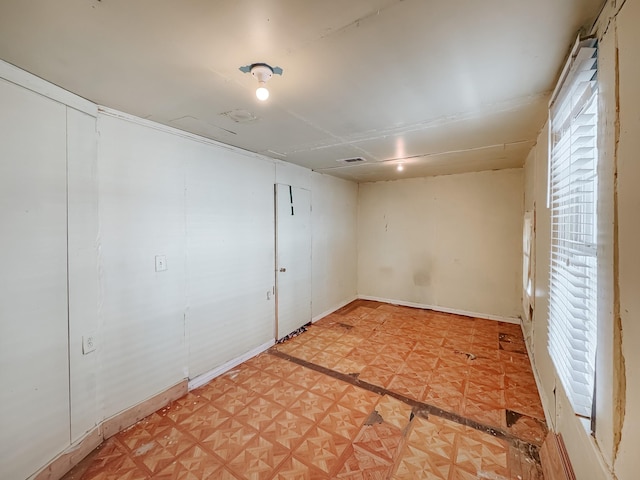 spare room with light parquet floors