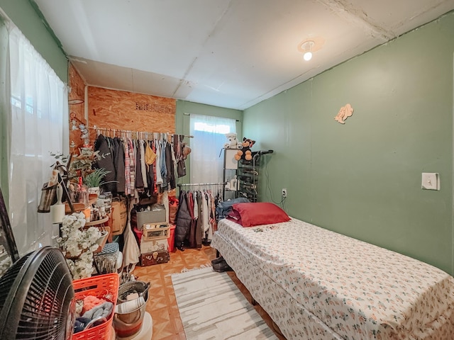 bedroom with light parquet floors