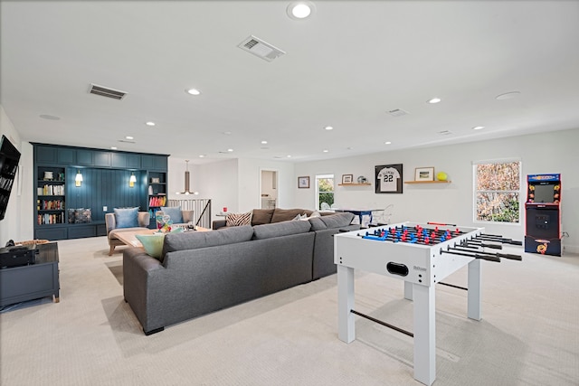 game room with light colored carpet