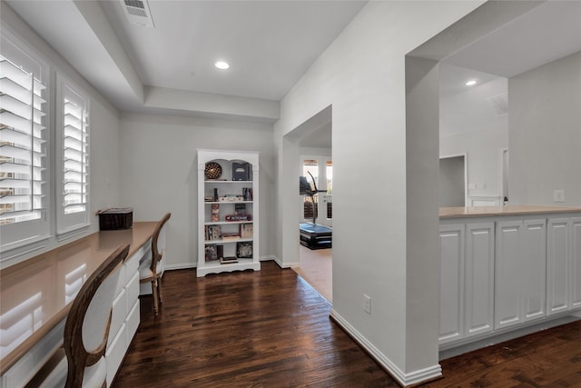 office space with dark hardwood / wood-style flooring