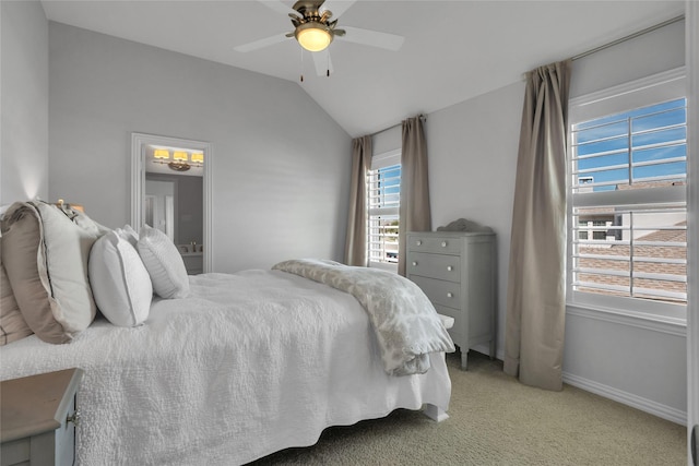 carpeted bedroom with vaulted ceiling and ceiling fan