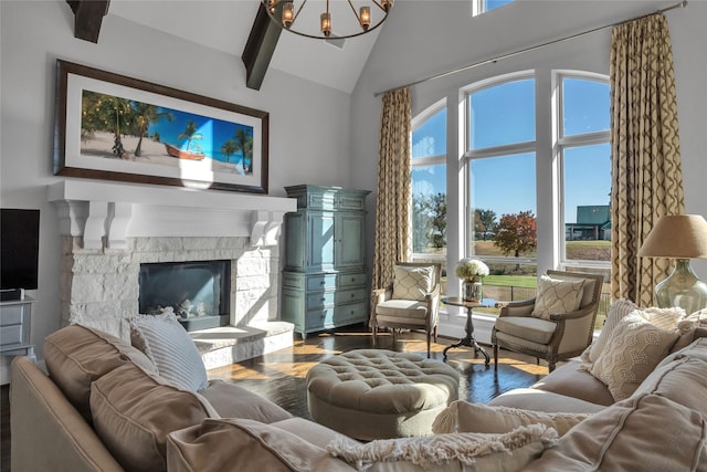 living room featuring hardwood / wood-style flooring, high vaulted ceiling, a notable chandelier, a stone fireplace, and beamed ceiling