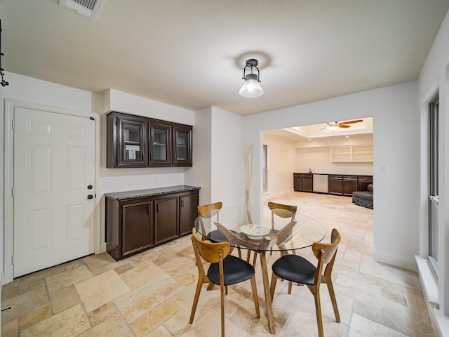 dining space with ceiling fan