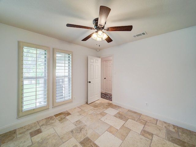 empty room featuring ceiling fan