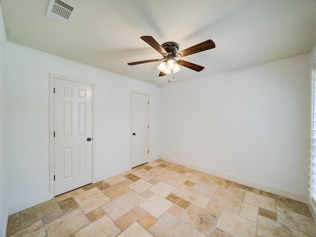 unfurnished room with ceiling fan