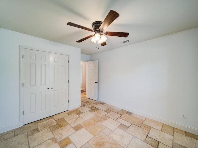 unfurnished bedroom featuring a closet and ceiling fan